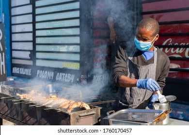 Cape Town, South Africa - June 2020: African Street Food Vendor Wearing Protective Mask, Barbecue Grilled Chicken, Covid 19, Corona Virus, Reopen.