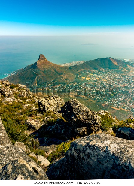 Cape Town, South\
Africa: looking down at the coastline and Lions Head mountain from\
Table Top Mountain.