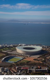 Cape Town / South Africa - March 27 2018: Arial View Of Green Point Football Stadium In Cape Town With Ocean Behind It. 