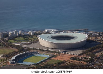 Cape Town / South Africa - March 27 2018: Arial View Of Green Point Football Stadium In Cape Town With Ocean Behind It. 