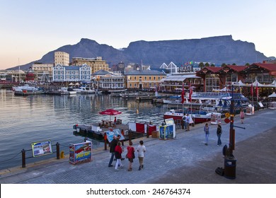 Cape Town, South Africa - March 5 2010: People Walking In  The Victoria And Albert Waterfront At Dusk