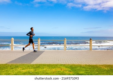 Cape Town, South Africa - May 12, 2022: Jogger On Sea Point Promenade On The Atlantic Seaboard