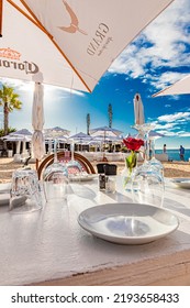 Cape Town, South Africa - May 12, 2022: Table Setting At Grand Africa Cafe And Beach Bar Restaurant