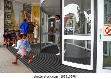 Cape Town, South Africa - November 2020: African Father Takes Daughters To The Mall For An Ice Cream, Wearing Face Masks For Corona Virus/ Covid 19 Pandemic. Economic Recovery In Africa. 