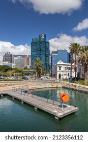 CAPE TOWN, SOUTH AFRICA - Sep 16, 2021: First National Bank building in the Cape Town skyline in front of Table Mountain, with the V A Waterfront in the foreground 