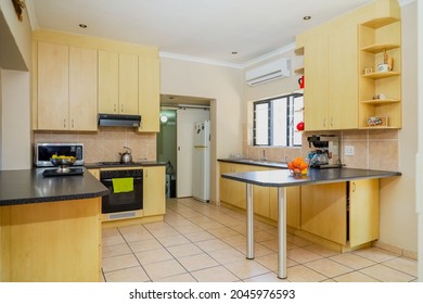 Cape Town, South Africa - September 2021: Open Plan Kitchen, With Built In Cupboards, Oven, Stove And Hob. Family Home Kitchen.