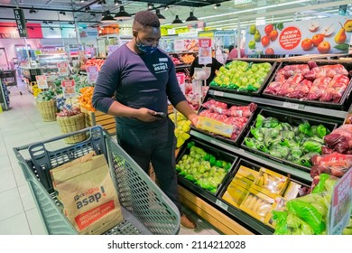 Cape Town, South Africa - September 9, 2021: Staff Member Picking Products From Shelf For Express Home Delivery Service