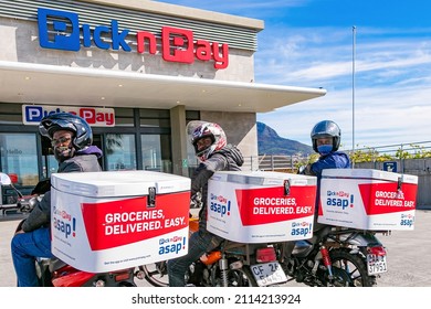 Cape Town, South Africa - September 9, 2021: Express Service Delivery Bikes With African Riders Outside Local Pick N Pay Grocery Store