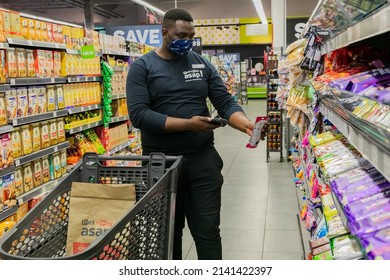 Cape Town, South Africa - September 9, 2021: Staff Member Picking Products From Shelf For Express Home Delivery Service