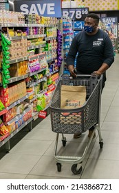 Cape Town, South Africa - September 9, 2021: Staff Member Picking Products From Shelf For Express Home Delivery Service