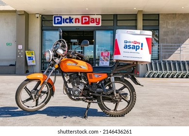 Cape Town, South Africa - September 9, 2021: Express Service Delivery Bike Parked Outside Local Pick N Pay Grocery Store