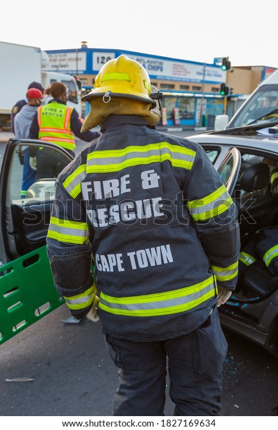 Cape Town, South Africa - September 2020: fire and\
rescue team at accident scene in Africa. South African Taxi in\
automobile crash Firemen on scene to save victims. Road Accident\
Fund.