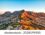 Cape Town Sunset over Camps Bay Beach with Table Mountain and Twelve Apostles in the Background, South Africa 