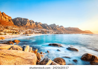 Cape Town Sunset over Camps Bay Beach with Table Mountain and Twelve Apostles in the Background, South Africa  - Powered by Shutterstock