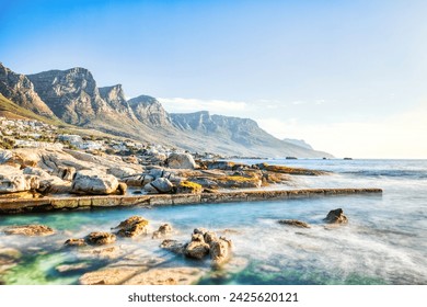 Cape Town Sunset over Camps Bay Beach with Table Mountain and Twelve Apostles in the Background, South Africa  - Powered by Shutterstock