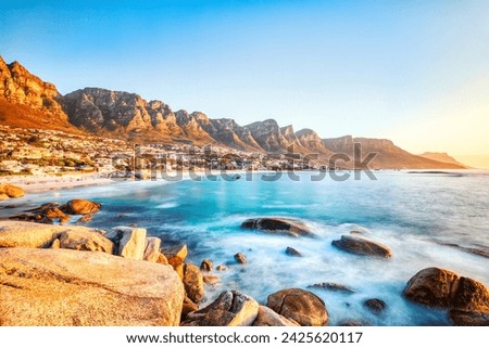 Cape Town Sunset over Camps Bay Beach with Table Mountain and Twelve Apostles in the Background, South Africa 