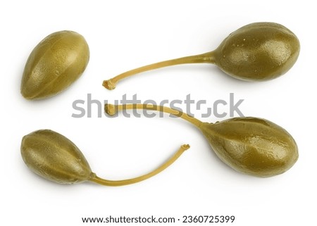 Capers isolated on white background. Pickled or canned capers. Top view. Flat lay