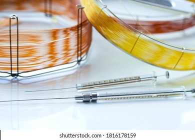 capillary columns of different lengths for gas chromatographic analysis and glass syringes for sample insertion. equipment for analytical chemistry in the laboratory.
