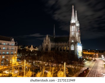 Capital Of Austria Vienna At Night, View On Gothic Church And Streets Of Old City