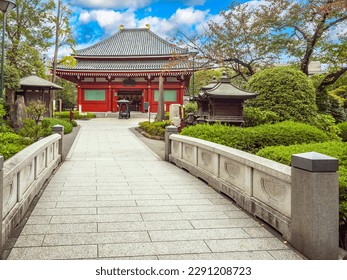 Capital of Japan. Tokyo province. ReligioUS temple. Buddhist building in park. Tokyo on summer day. Tour of capital of Japan. Sights of Japanese cities. Culture of east asia. Travel to Japan