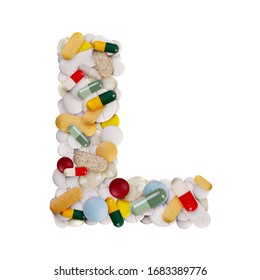 Capital letter L made of various colorful pills, capsules and tablets on isolated white background