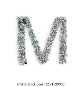 Capital Letter M Made From Screws And Bolts. Alphabet Made From Used Screws. White Background. Industrial Bolt Font