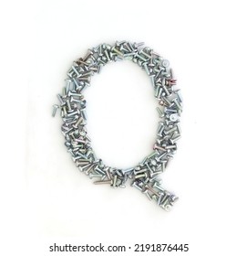 Capital Letter Q Made From Screws And Bolts. Alphabet Made From Used Screws. White Background. Industrial Bolt Font