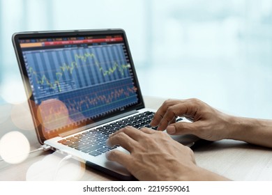 Capital Uncles Trade stocks Online while Working Next to the office. - Shutterstock ID 2219559061