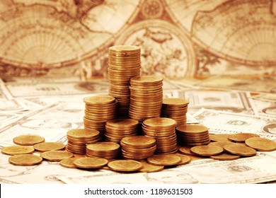 Capitalism concept : Coin stack on bank note and vintage map background.