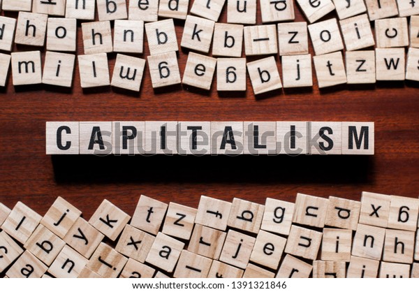 Capitalism word concept on cubes