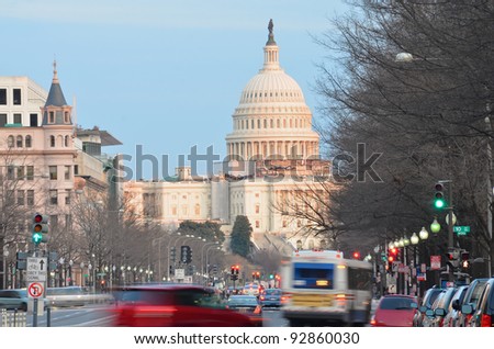 Capitol building from Pennsylvania Avenue with car traffic foreground - Washington DC United States
