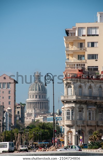 Capitol of Havana seen across a main avenue of\
Old Havana. Havana Cuba. May 12,\
2015