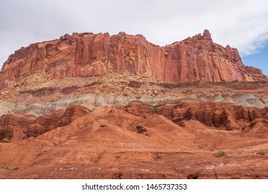 Capitol Reef National Park Landscape Of Red, Orange, Pink And White Barren Rock Hillsides 