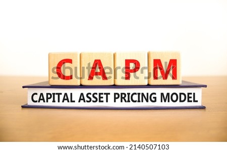 CAPM capital asset pricing model symbol. Concept words CAPM capital asset pricing model on cubes on a beautiful white background. Business CAPM capital asset pricing model concept. Copy space.