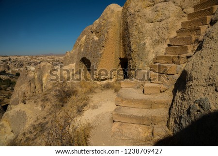 Cappadocia, Anatolia, Turkey: Degrees in the rock lead to the Church. The world heritage list of UNESCO