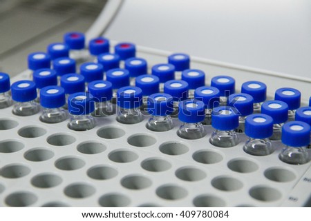Capped vials on an analysis autosampler, selective focus, laboratory instruments
