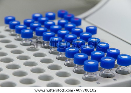 Capped vials on an analysis autosampler, selective focus, laboratory instruments