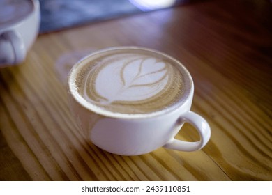             The cappuccino is a balanced coffee that’s a true test of any barista’s skills. Known for the even distribution of coffee and milk and served in a large cup with a dusting of chocolate on 