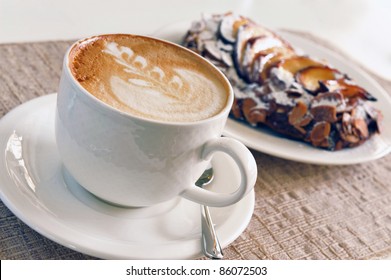 Cappuccino And Cake On The Table