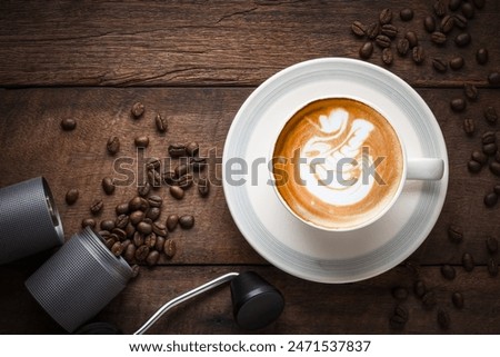 Cappuccino coffee in a beautiful glass on the table favorite cup of coffee concept.