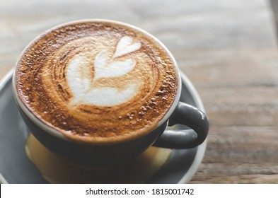 Cappuccino Coffee Close Up In The Making Above Wooden Table