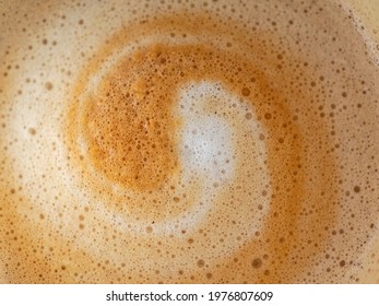 Cappuccino milk foam spiral closeup
