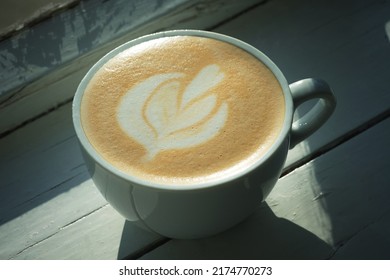 Cappuccino On A White Window Sill. Close Up