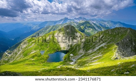 The Capra Lake. Summer landscape of the Fagaras Mountains, Romania. A view from the hiking trail near the Balea Lake and the Transfagarasan Road.