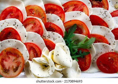 Caprese Salad With Arugula Plate Full Frame From Above