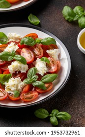 Caprese Salad With Cherry Plum Tomatoes, Mozzarella Cheese And Basil. Healthy Vegetarian Food