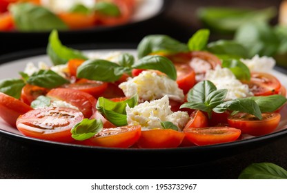 Caprese Salad With Cherry Plum Tomatoes, Mozzarella Cheese And Basil. Healthy Vegetarian Food