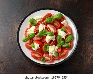 Caprese Salad With Cherry Plum Tomatoes, Mozzarella Cheese And Basil. Healthy Vegetarian Food