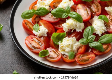 Caprese Salad With Cherry Plum Tomatoes, Mozzarella Cheese And Basil. Healthy Vegetarian Food