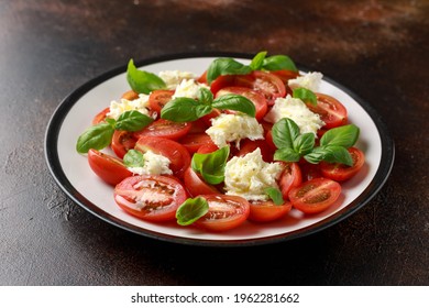 Caprese Salad With Cherry Plum Tomatoes, Mozzarella Cheese And Basil. Healthy Vegetarian Food